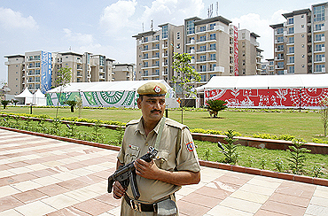 A policeman stands guard at the Commonwealth Games village in New Delhi
