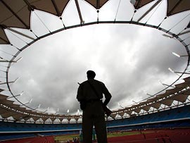 A security guard mans a stadium to be used for the Commonwealth Games in New Delhi