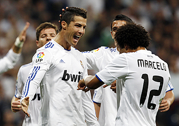 Cristiano Ronaldo (left) celebrates with teammates after scoring against Espanyol