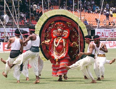 Dancers from Kerala perform at a cricket match