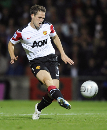 Manchester United's Michael Owen shoots to score against Scunthorpe United during their English League Cup soccer match in Scunthorpe