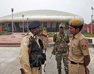 Indian security personal outside the weightlifting venue for the upcoming Commonwealth Games in New Delhi