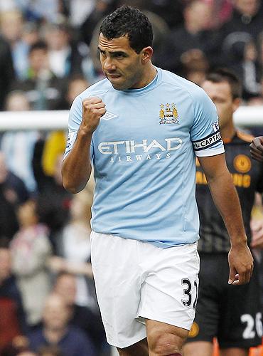 Carlos Tevez celebrates after scoring against Chelsea