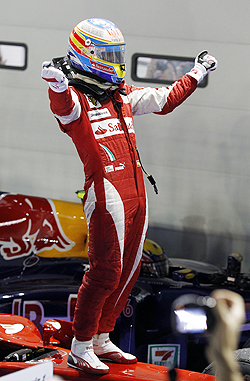 Fernando Alonso celebrates after winning the Singapore GP on Sunday