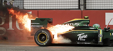 The car of Lotus driver Heikki Kovalainen goes up in flames during the Singapore F1 Grand Prix