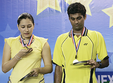 India's Diju and Jwala Gutta with their runners-up medals at the World Super Series badminton tournament in December