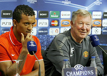 Manchester United's Nani (left) with manager Alex Ferguson