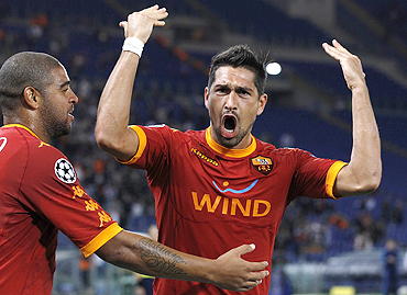 AS Roma's Marco Borriello (right) celebrates with teammate Adriano after scoring against CFR Cluj