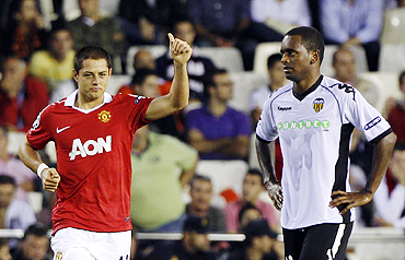 Manchester United's Javier Hernadez (left) celebrates after scoring against Valencia