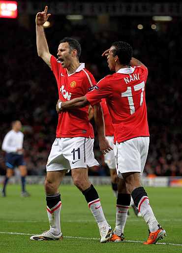 Manchester United's Ryan Giggs and Nani celebrate a goal against Chelsea