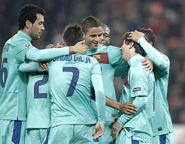 Barcelona players celebrate after winning the match against Shaktar