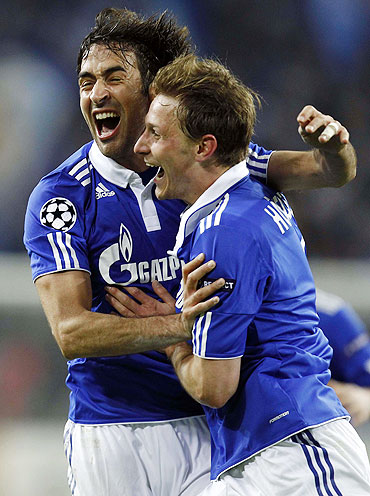 Raul Gonzalez (left) and Benedikt Hoewedes of Schalke 04 celebrate after scoring