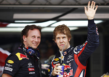 Red Bull's Sebastian Vettel (right) with team principal Christian Horner after the second practice session in Shanghai on Friday