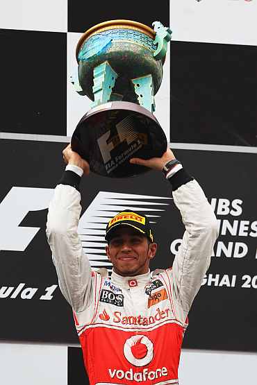 McLaren's Lewis Hamilton celebrates after winning the Chinese Formula One Grand Prix at the Shanghai International Circuit
