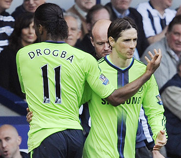 Chelsea's Didier Drogba (left) is substituted by Fernando Torres