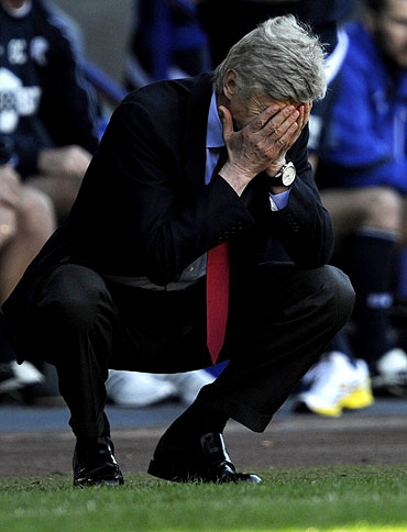 Arsenal's manager Arsene Wenger reacts during the match against Bolton Wanderers