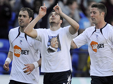 Bolton Wanderers' Tamir Cohen (centre) celebrates with teammates after scoring against Arsenal