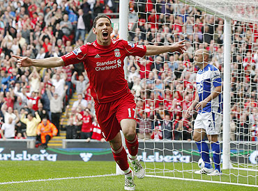 Liverpool's Maxi Rodriguez celebrates after scoring against Birmingham City