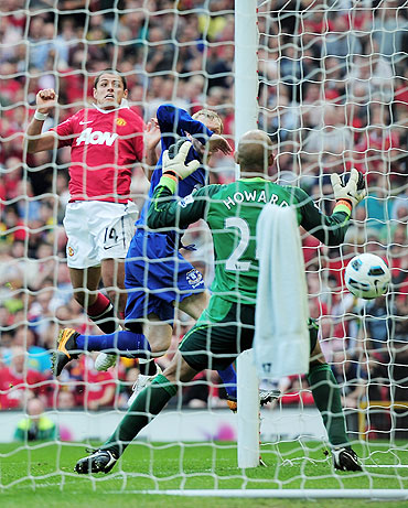 Manchester United's Javier Hernandez heads to score goal against Everton