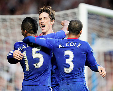Chelsea's Fernando Torres celebrates with Florent Malouda (left) and Ashley Cole after scoring