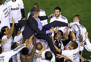 Jose Mourinho is thrown up in the air by Real Madrid players after winning Kings Cup