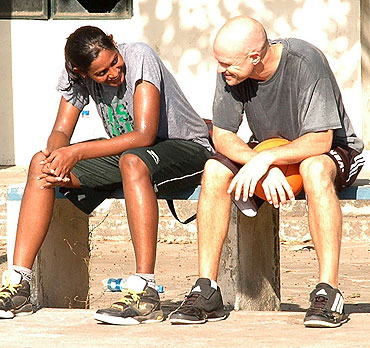 Geetu Anna Jose and Troy Justice take a break during training