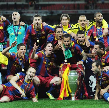 Barcelona players celebrate winning the 2010-11 UEFA Champions League