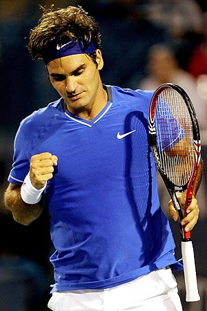 Roger Federer celebrates after defeating Juan Martin Del Potro 