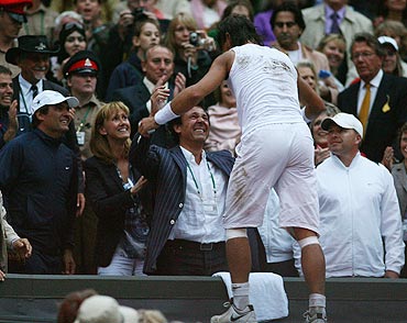 Rafael Nadal celebrates with his parents after winning the 2008 Wimbledon Championships