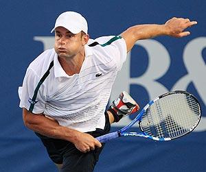 Andy Roddick of the USA serves to Edouard Roger-Vasselin