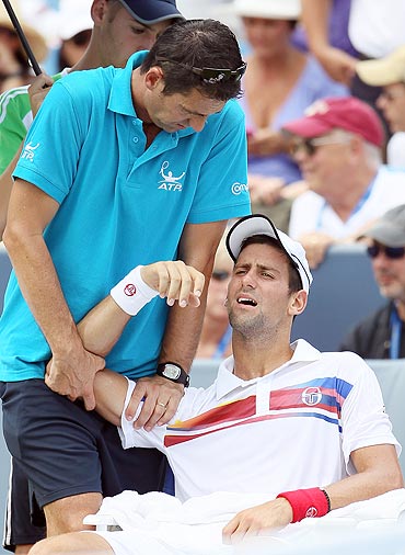 Novak Djokovic is treated by ATP trainer Hugo Gravil during the Cincinnati Open final last week