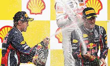 Sebastian Vettel (L) and Mark Webber celebrate after the Belgian Formula One Grand Prix win