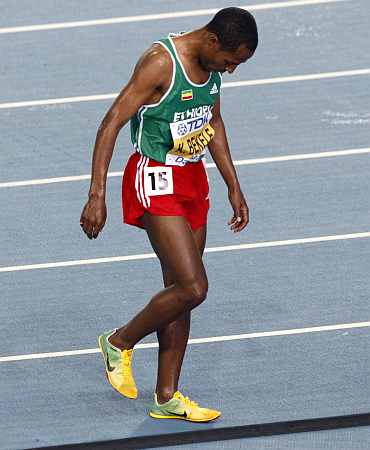 Kenenisa Bekele of Ethiopia leaves the track after pulling out of the men's 10,000 metres final