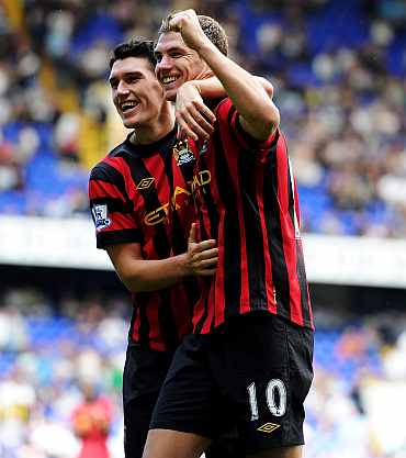 Edin Dzeko celebrates after scoring against Tottenham Hotspur