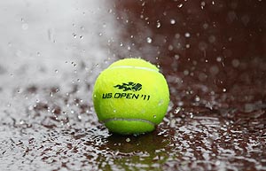 Heavy rain falls on a tennis ball