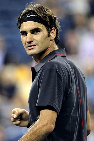 Roger Federer celebrates after defeating Santiago Giraldo in the 1st round of the US Open on Monday