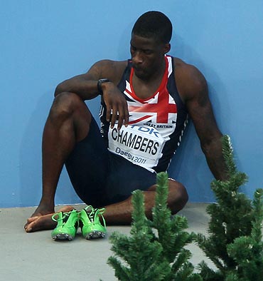 Dwain Chambers of Great Britain shows his dejection after being disqualified for a false start during his men's 100 metres semi-finals on Sunday