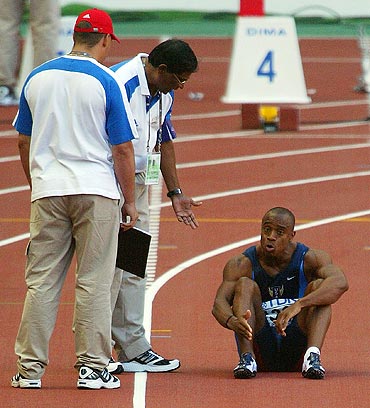 Jon Drummond of USA protests his innocence to a false start during the men's 100m quarter-final at the 2003 IAAF World Athletics Championship in Paris