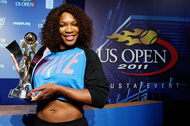 Serena Williams poses with the Olympus US Open Series Trophy