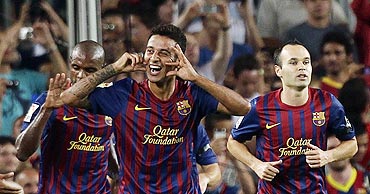 Barcelona's Thiago Alcantara (centre) celebrates after scoring a against Villarreal