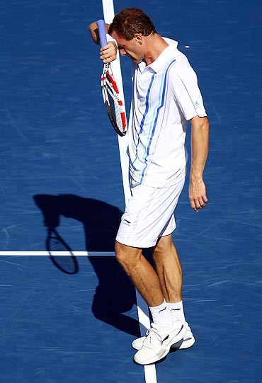 Conor Niland reacts during his match against Novak Djokovic