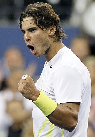 Rafael Nadal reacts after defeating Andrey Golubev