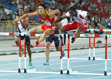 Dayron Robles of Cuba and Xiang Liu (left) of China during the men's 110 metres hurdles final on Monday