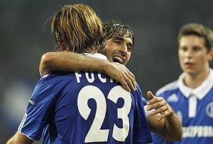 Schalke 04's Christian Fuchs and Raul (right) celebrate against Steaua Bucharest