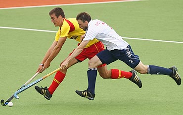 Great Britain's Ken Forbes and Spain's Alex Casasayas vie for possession during their match on Tuesday
