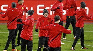 Manchester United's Wayne Rooney (centre) smiles during a team training session in Basel on Tuesday