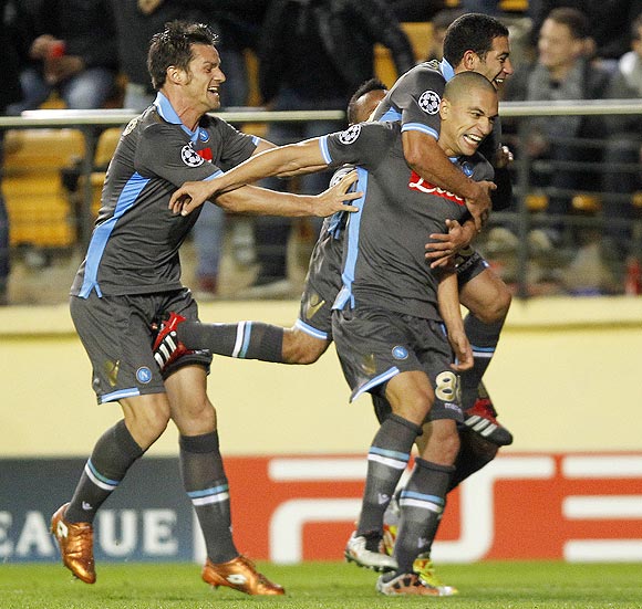 Napoli's Gokhan Inler (front right) celebrates with teammates Walter Gargano and Christian Maggio (left) after scoring against Villarreal