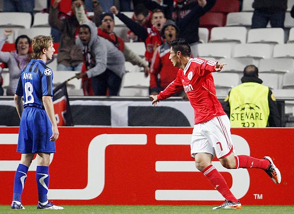 Benfica's Oscar Cardozo (right) celebrates beside Otelul Galati's Liviu Antal