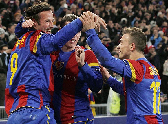 FC Basel's Marco Streller (left) celebrates with teammates Markus Steinhoefer (centre) and Xherdan Shaqiri after scoring