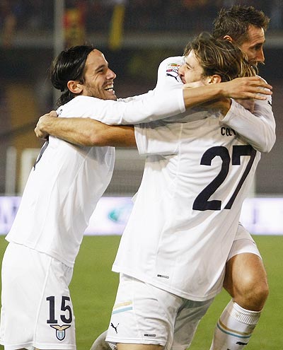 Lorik Cana (centre) of Lazio celebrates with team-mates Alvaro Gonzalez (left) and Miroslav Klose after scoring